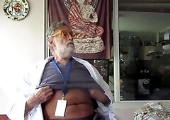 Older man enjoys solo time while two guys strip and put on a show