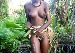Consummate body darksome skin Afro village beauty dancing in Raffia half nude outdoor