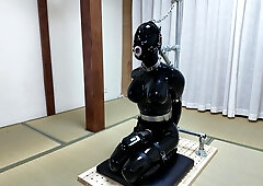 Asian rubber sissy gets tightly restrained and punished