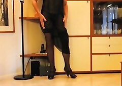 Shemale teases in her high heels and stockings before masturbating