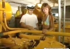 Passionate milf is having sex with two guys from the ship crew, at the same time