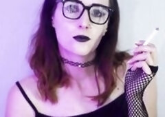 Darksome gothic hotty smokes during the time that wearing fishnet nylons. This babe takes slow, seductive drags with her ebony lipstick and fishnets o