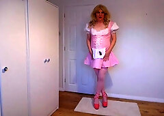 Close up of a cute blonde in pink dress and no panties