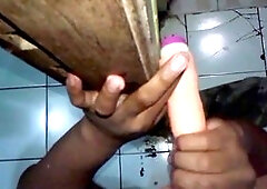 Gay dude gets pounded doggy style with a dildo