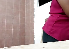 Plump cutie in a strap cooking