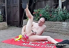 British DILF in the garden dildo fucking his ass while locked in chastity