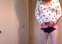 Pink miniskirt and white patterned pantyhose