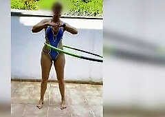 Swiss wench in Naughty Weasel swimsuit hula hoop. zoom in and slow motion. Sheer vision. Hard, frozen, erected teats. Watch throughout cunt lips. Real