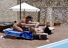 Julia Nortn and Jordan Perry like to eat every other up next to the swimming pool