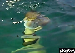 Stylish short haired chick Britt Linn goes out for a in nature's garb swim