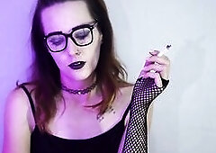 Darksome gothic angel smokes during the time that wearing fishnet nylons. That babe takes slow, seductive drags with her ebony lipstick and fishnets o