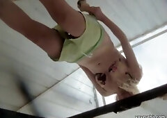 A glamorous teen cutie is in the beach cabin. That Babe is getting caught on the voyeur camera when taking off the light green shorts and changing the