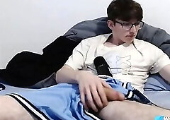 Nerdy Twink Scrolling While Stroking His Big Dick