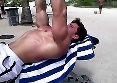 Muscle Guy Works Out on Beach