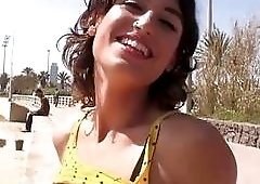 Brunette with a nice pair of teeth strokes futanari meat