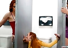 Busty redhead sucks n fucked by shemales through gloryholes